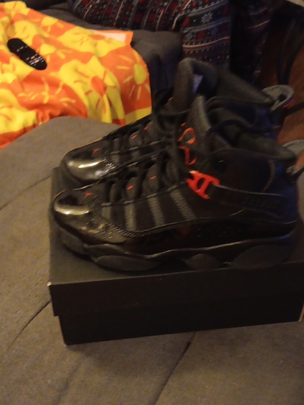 Black High-Top Sneakers with Red Accents